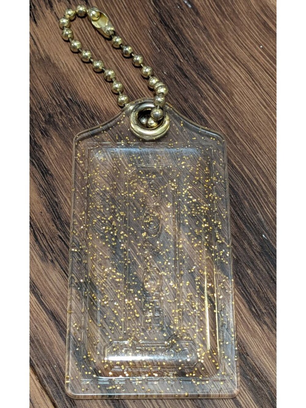 Coach clear large hangtag with gold glitter